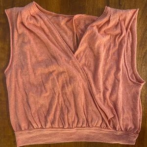 Pale orange shirt with open back detail. Size small